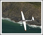 Dimona Motor Glider Flying over Byron Bay Lighthouse.jpg