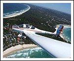 Dimona Motor Glider over Watego Beach.jpg