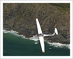 Dimona_Motor_Glider_Flying_over_Byron_Bay_Lighthouse.jpg
